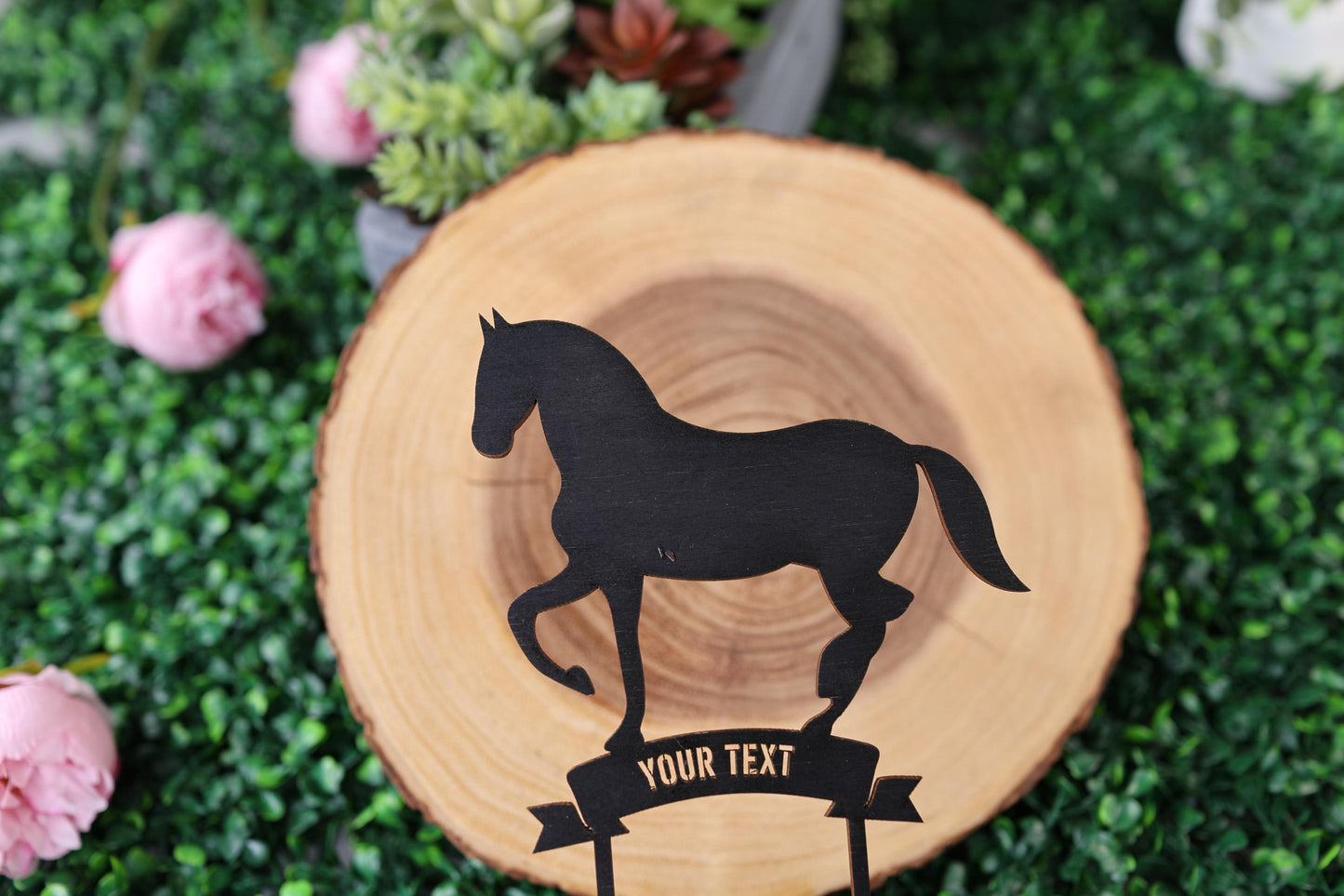 a wooden plate with a horse cut out of it