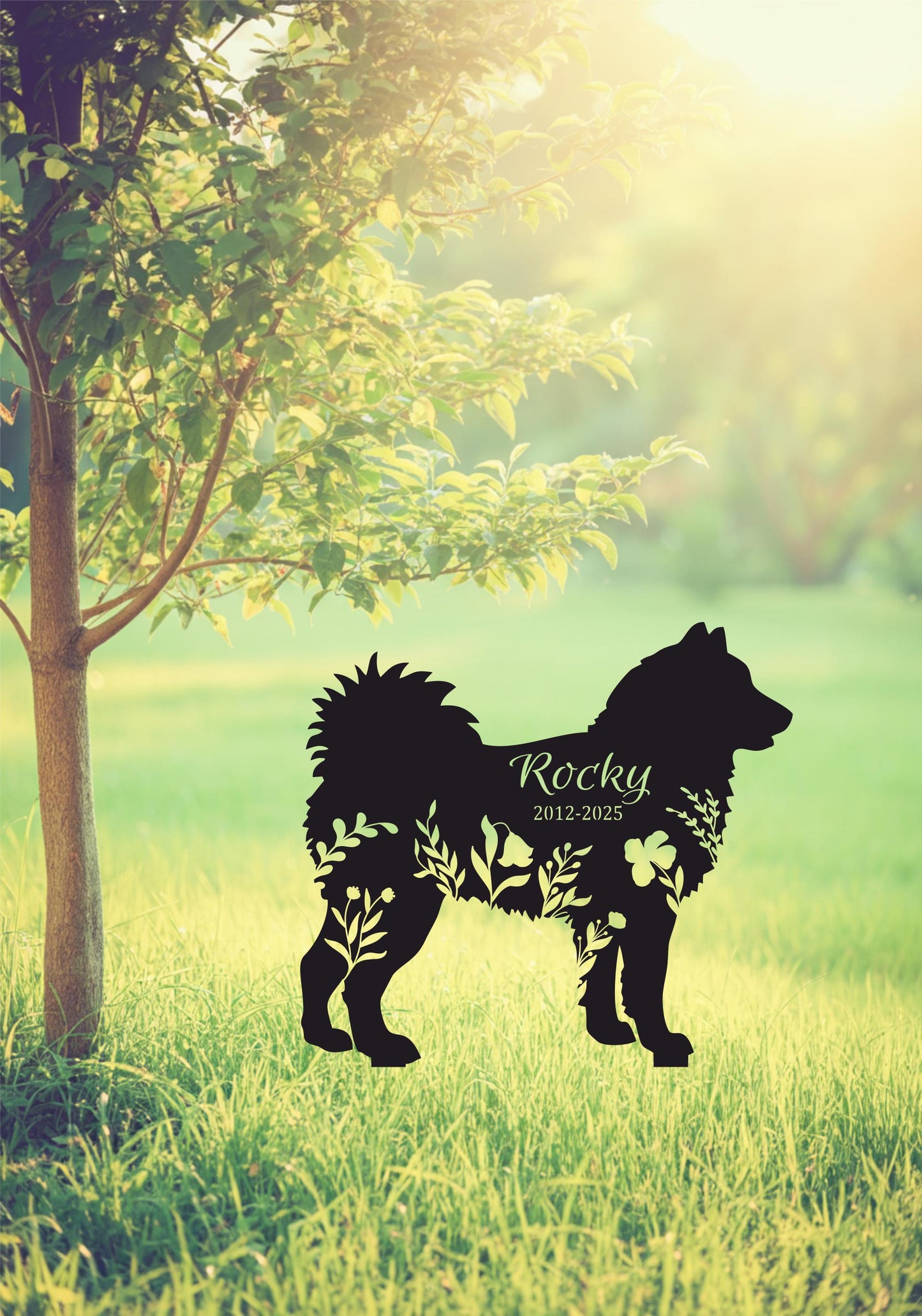 a silhouette of a dog standing next to a tree