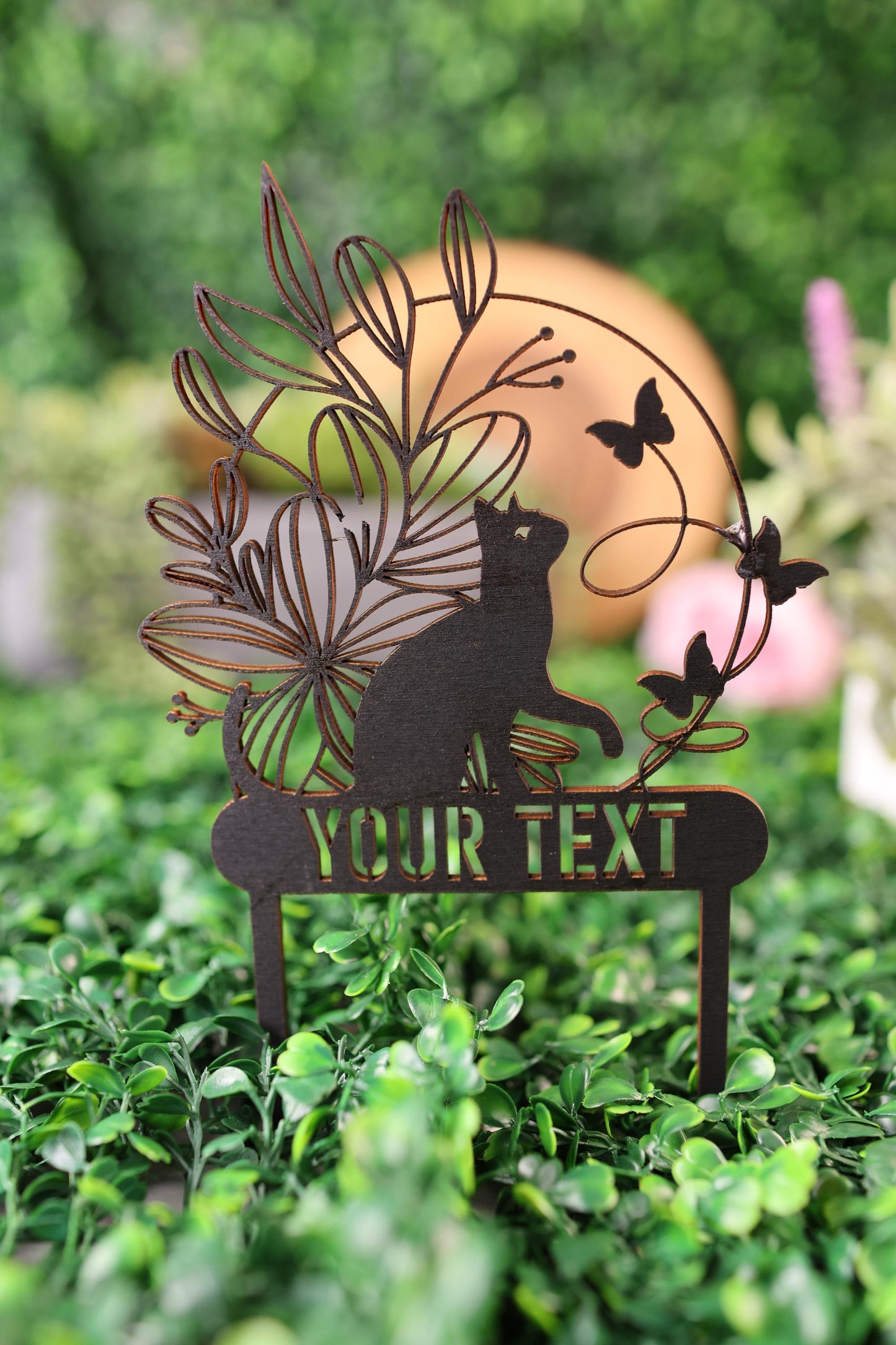 a close up of a metal sign on a bush