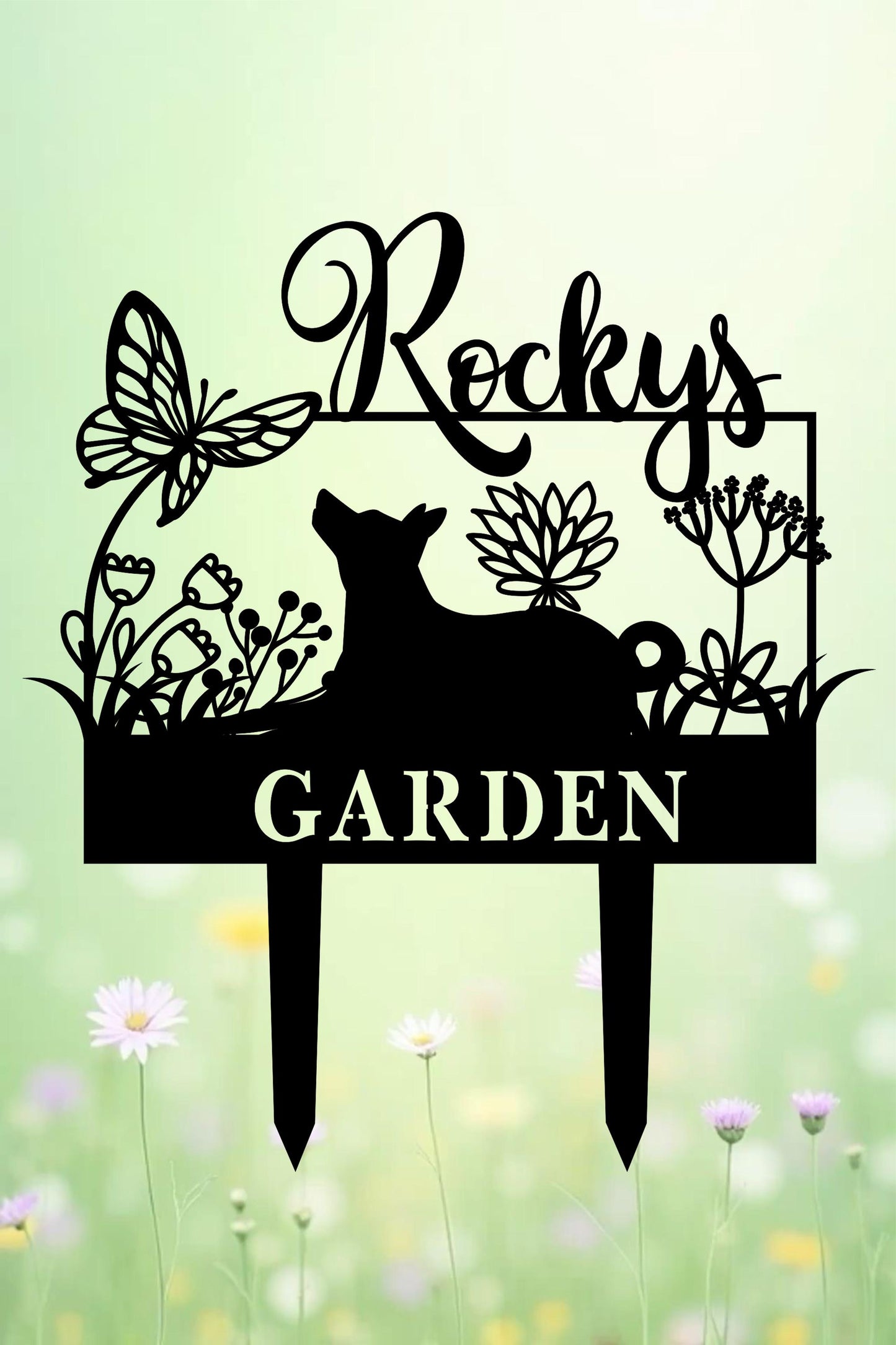 a metal garden sign with a dog in the grass