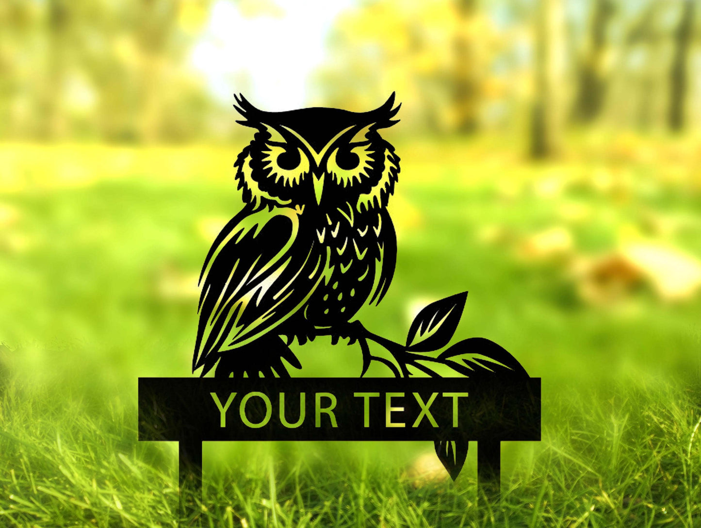 an owl is sitting on a sign in the grass