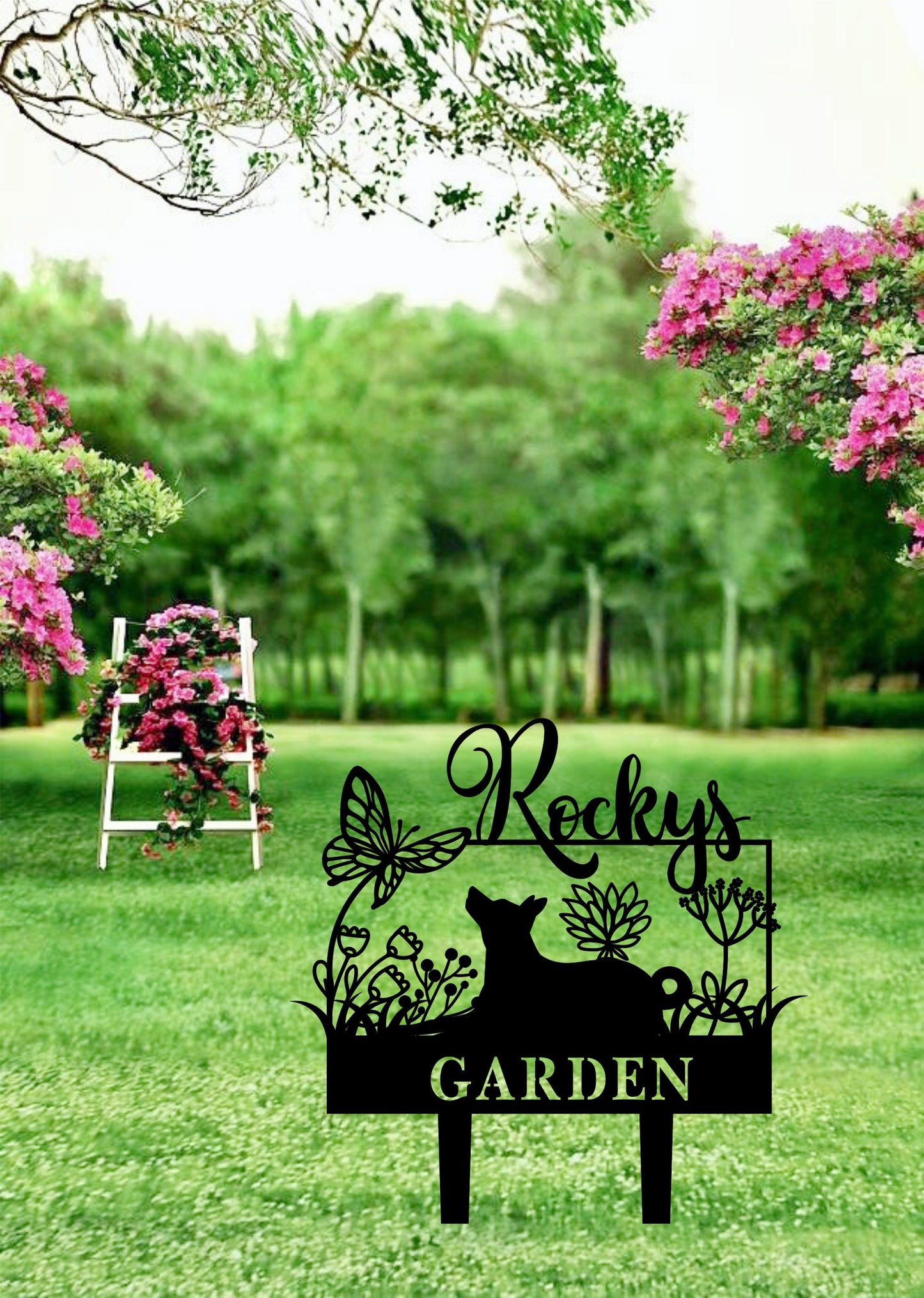 a garden sign sitting in the middle of a lush green field