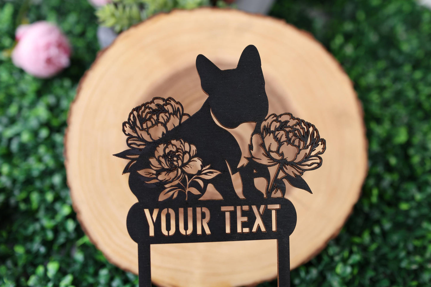 a wooden sign with a dog and flowers on it