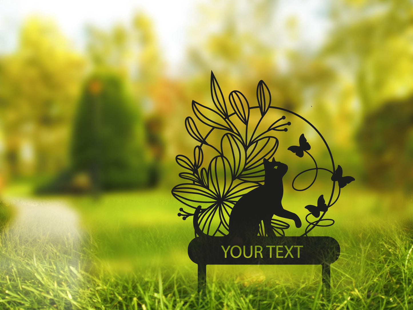 a sign that is in the grass with a cat on it