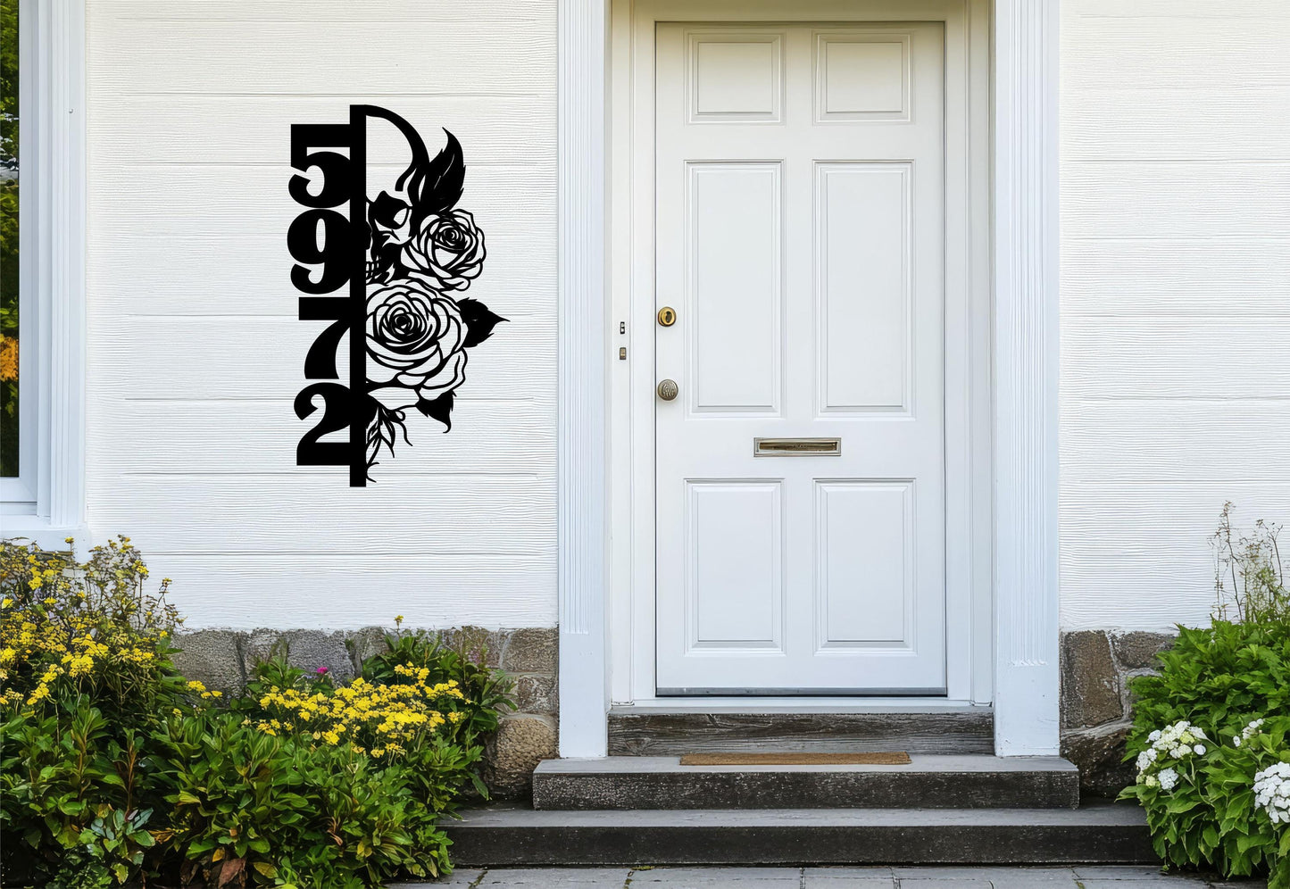 a white door with a black flower decal on it