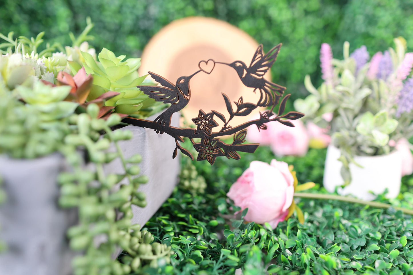 a couple of vases filled with flowers and plants
