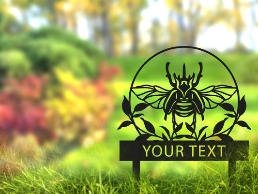 a picture of a bee on a sign in the grass