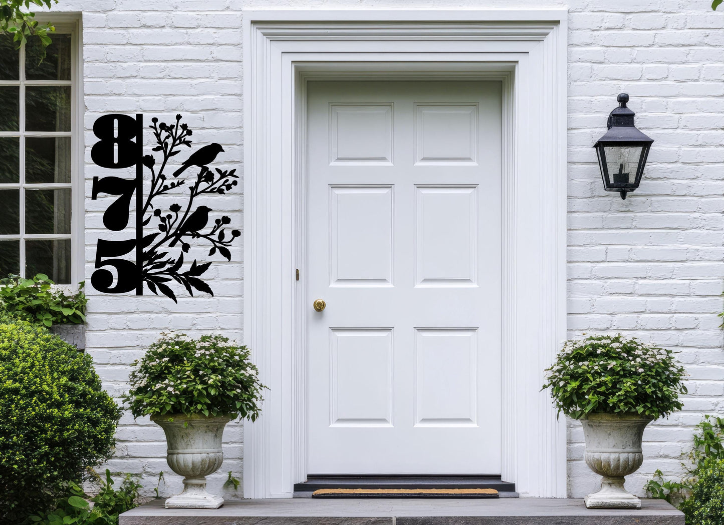 a white front door with a black and white design on it