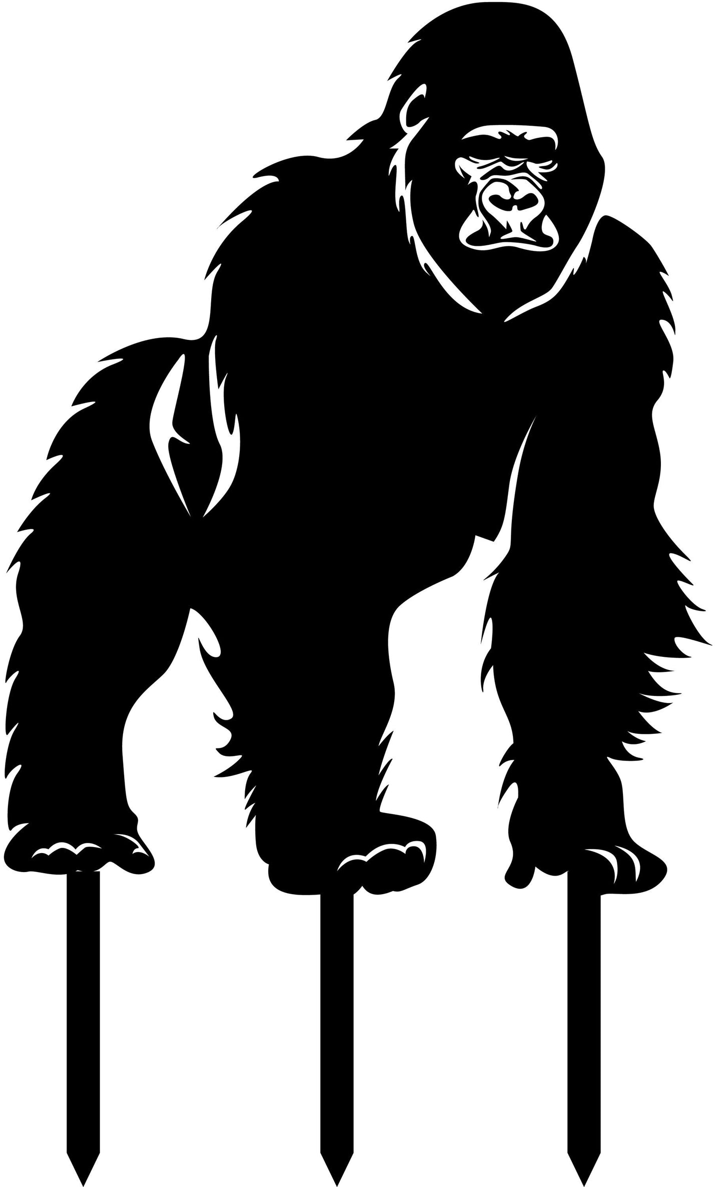 a black and white gorilla standing on top of a sign