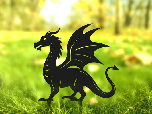 a paper cut of a dragon in a grassy field