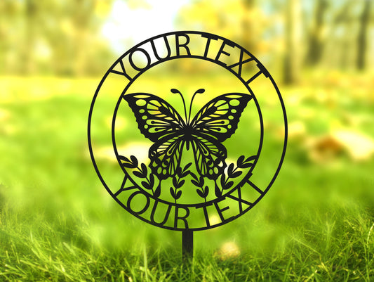 a metal sign with a butterfly on it