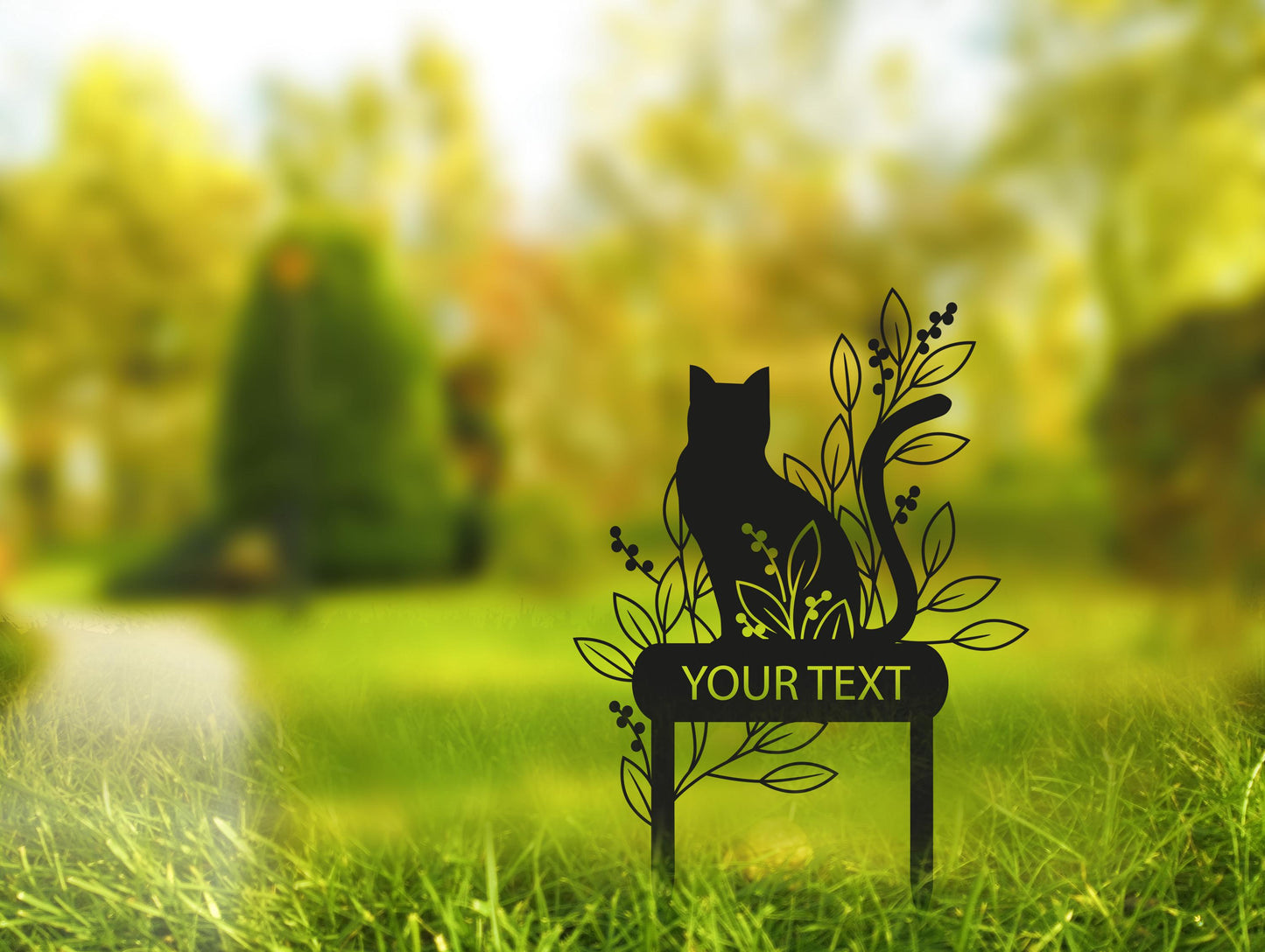 a cat sitting on a sign in the grass