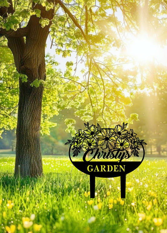 a sign that is in the grass near a tree