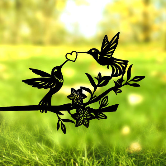 a couple of birds sitting on top of a tree branch