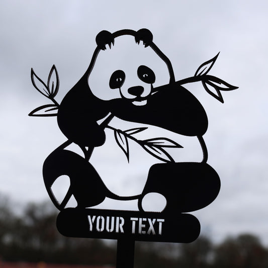 a black and white picture of a panda bear on a sign