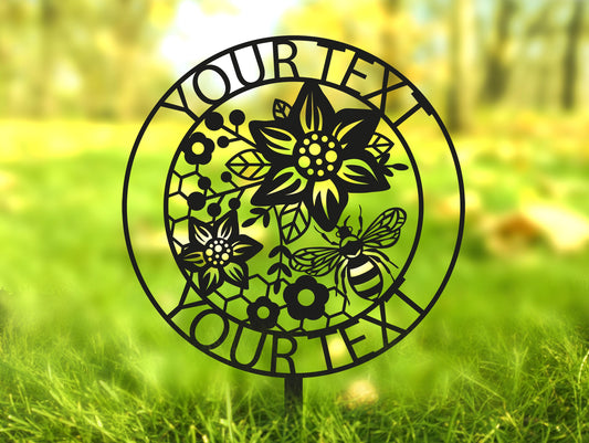 a metal sign with flowers and bees on it